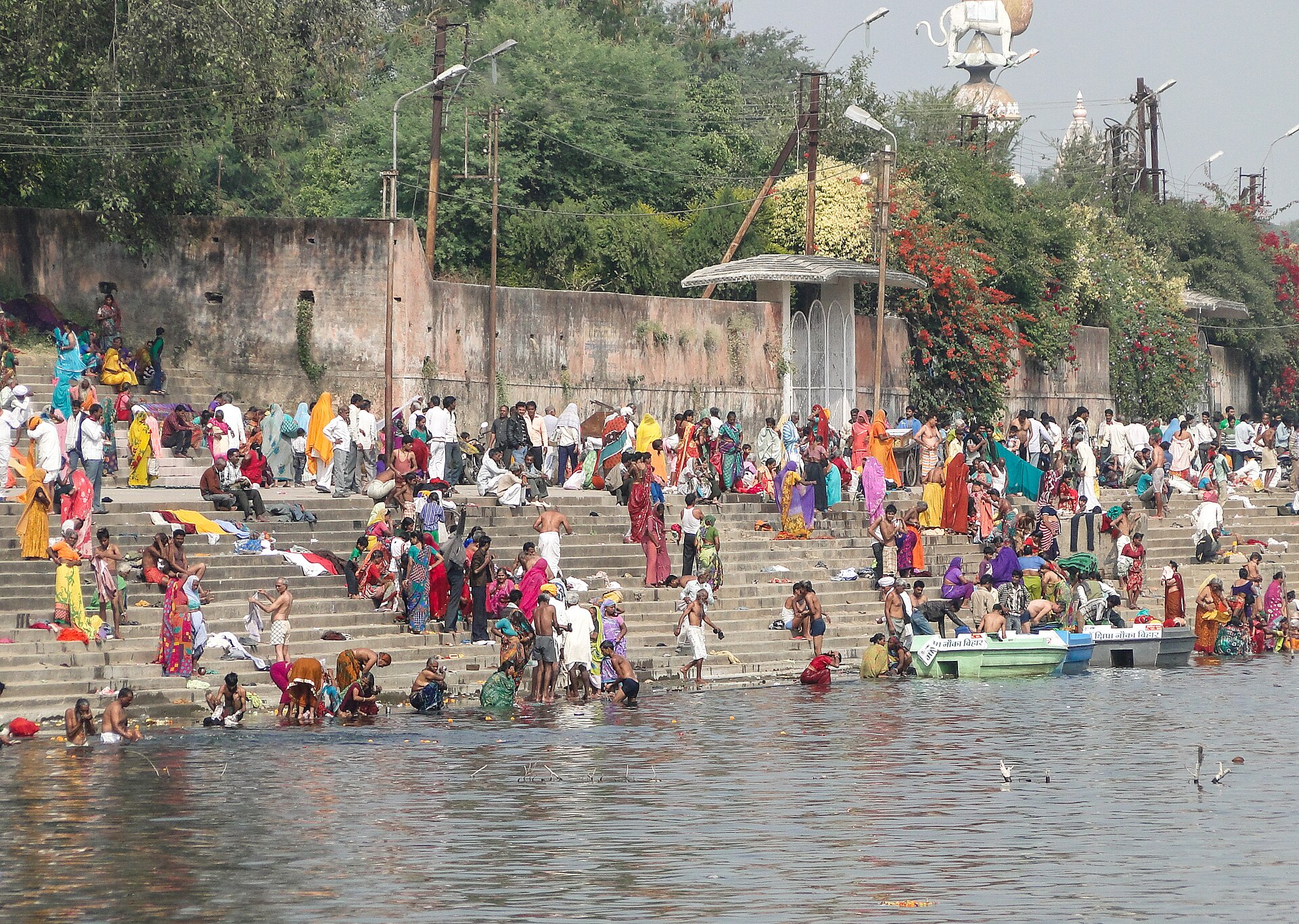 Mahakaleshwar temple spires rising above the Kshipra River ghats at golden hour, Ujjain