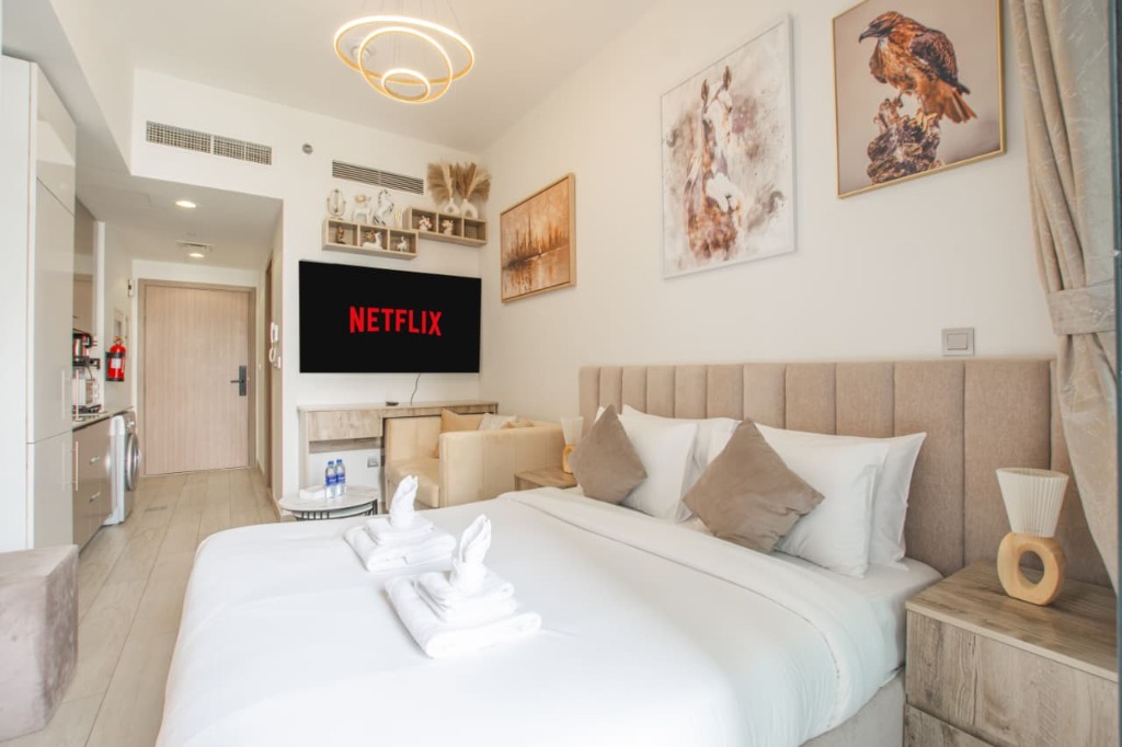 Modern premium suite with comfortable bedding and entertainment